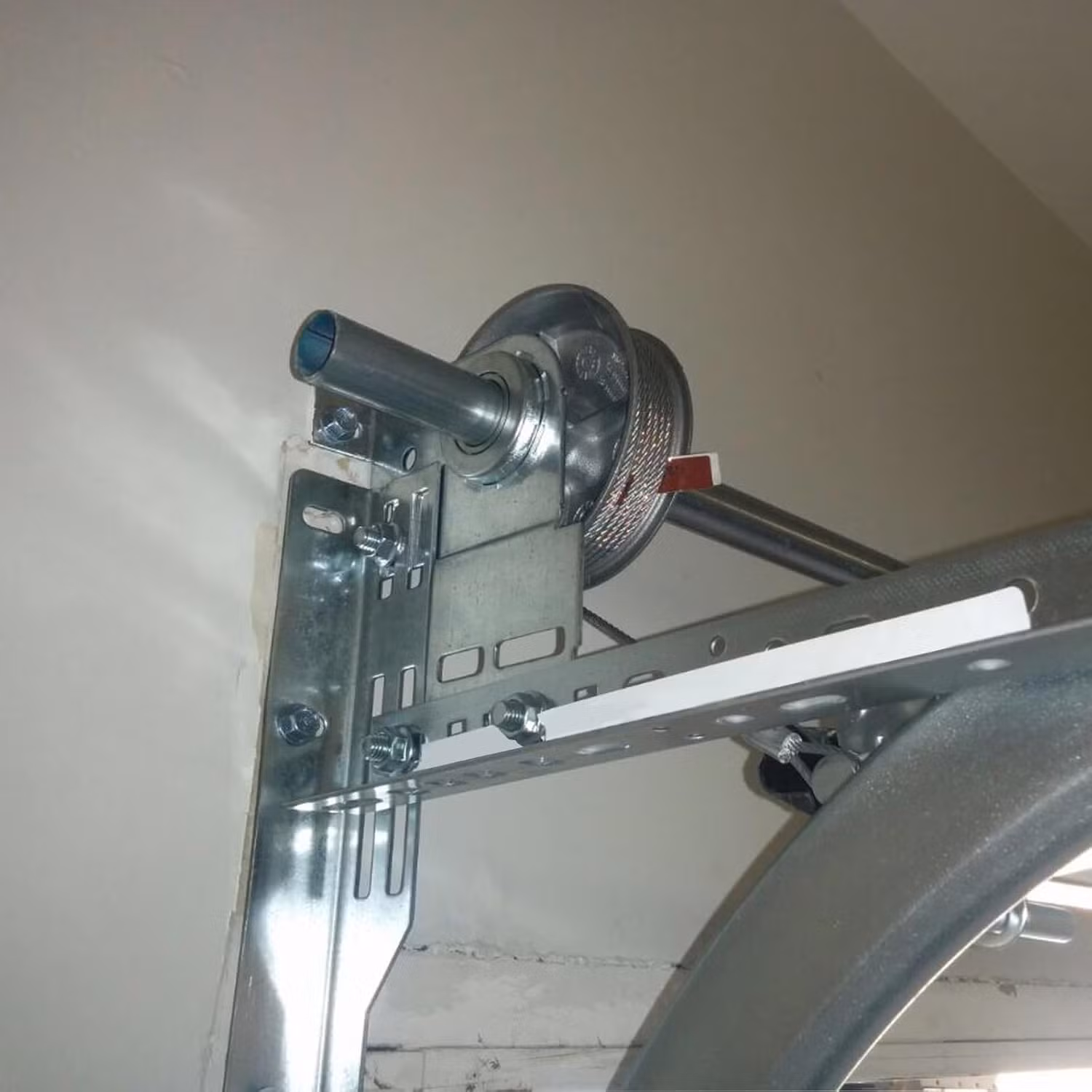 Garage door cable repair technician