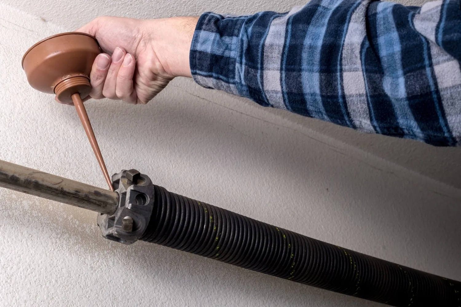 Signs of broken garage door spring