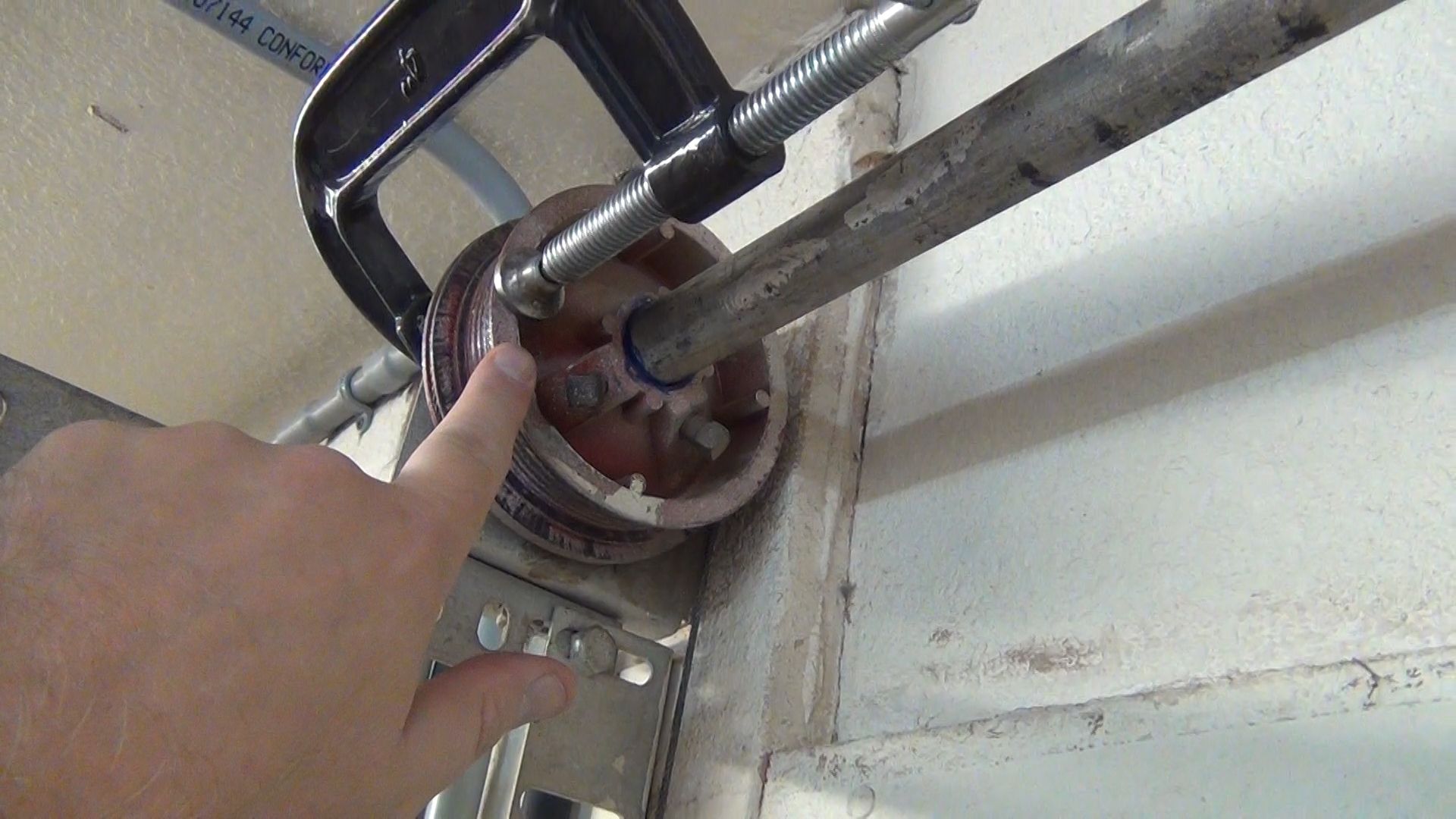 Garage door roller replacement technician